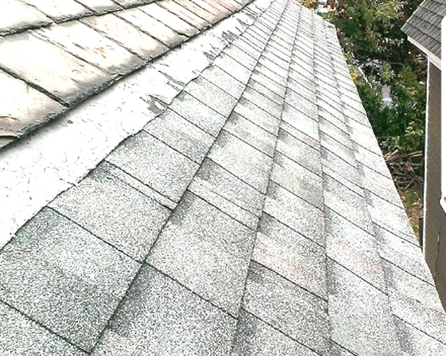 Finished roof alongside original slate roofing